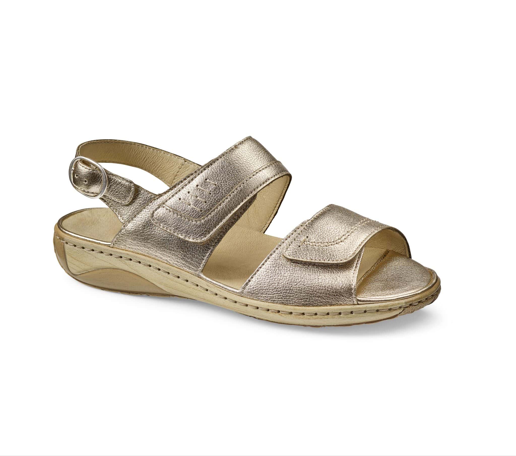 Dam sandal i metallic skinn, bekväm och stilren design.