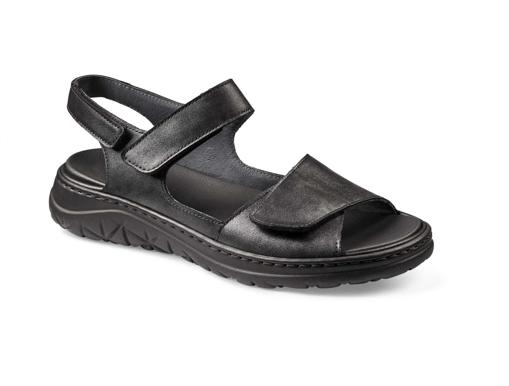 Svart sandal med justerbara remmar och gummisula för komfort och stil.
