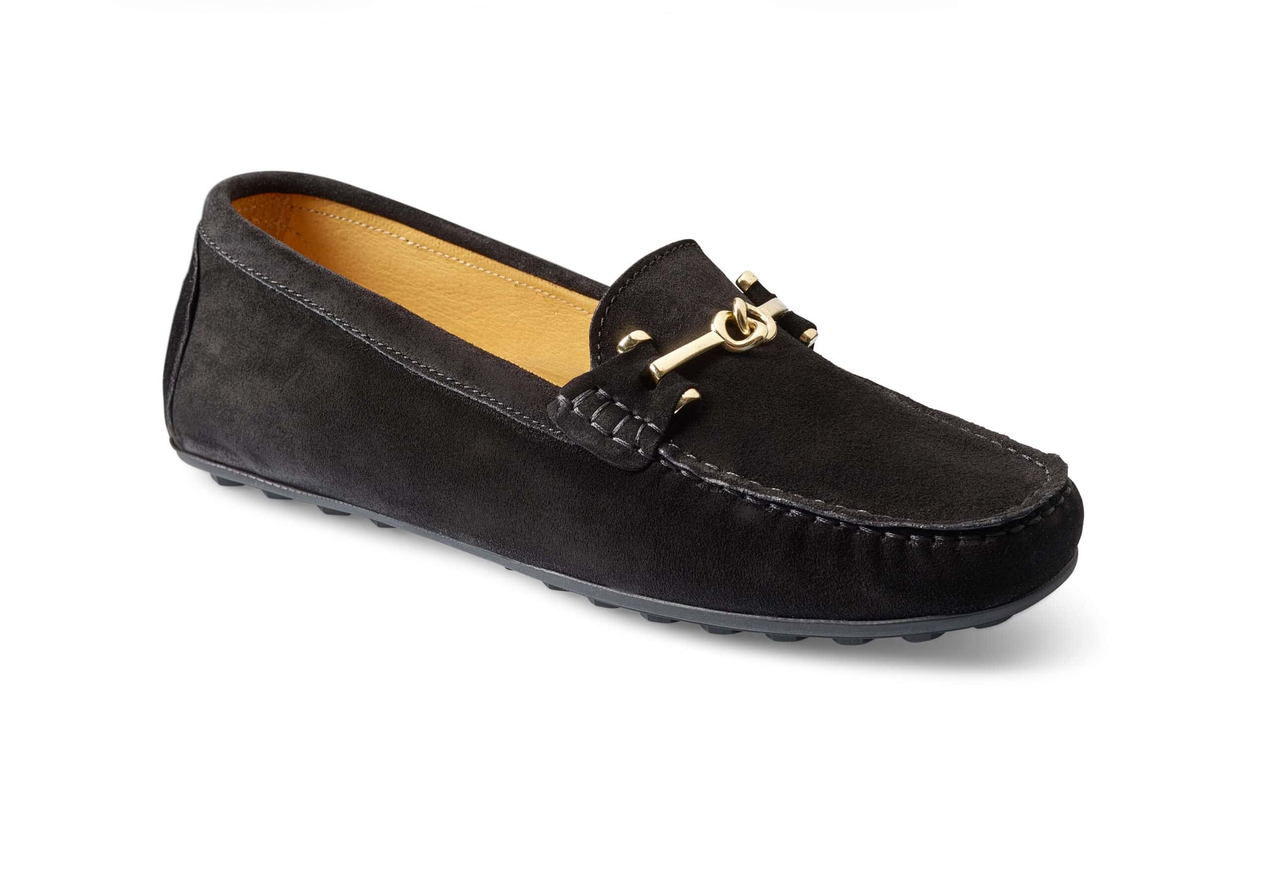 Svarta loafers i mocka med guldfärgad detalj framtill.