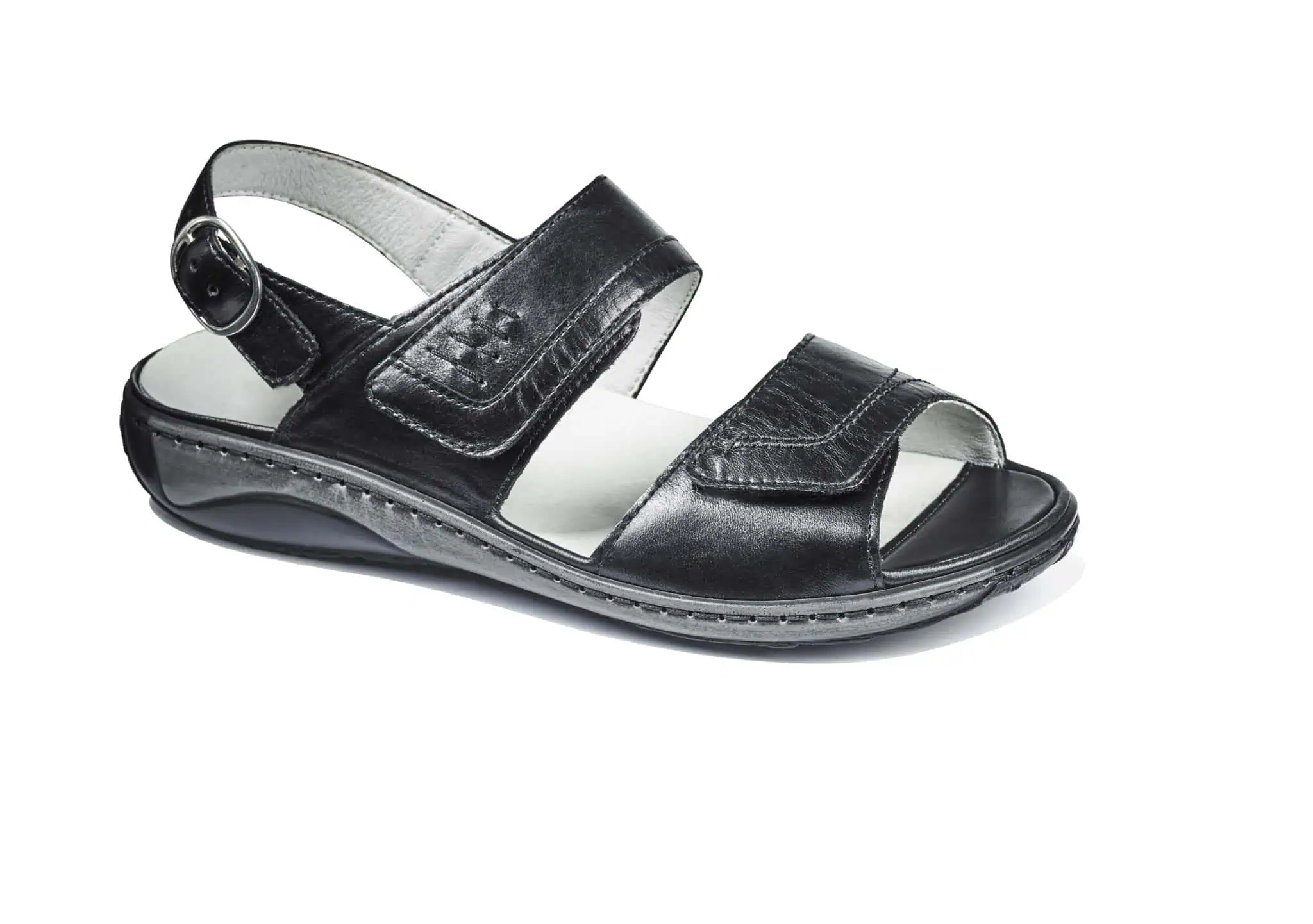 Skosandaler i svart läder med justerbar rem för bekväm passform.