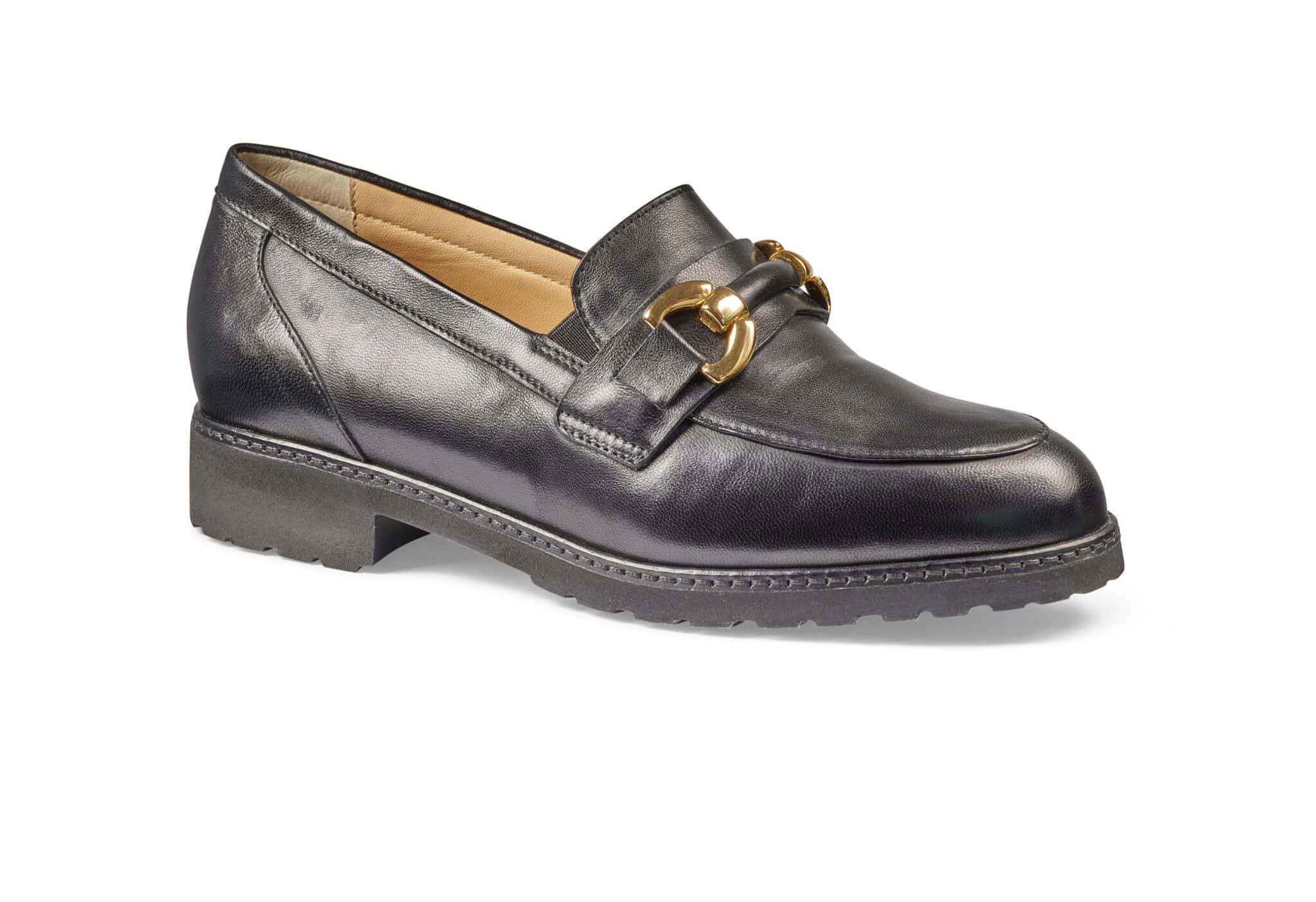 Svart lädersko med guldfärgad dekor för dam, klassisk och elegant design.