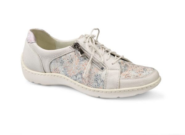 Dam sneakers i ljus färg med blommönster och sidoförstärkning.