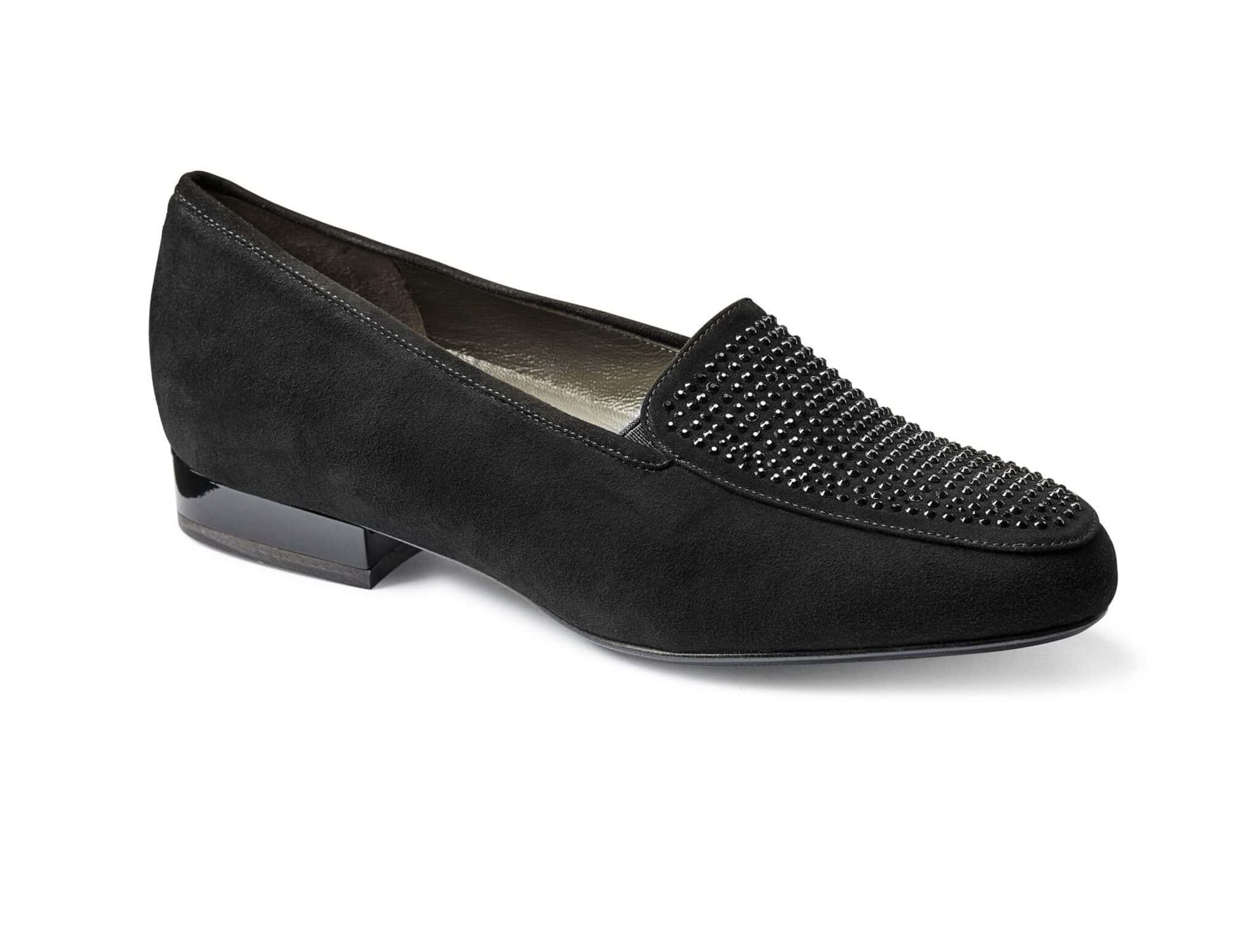 Svart damkvinna med dekorativa stenar på ovansidan, elegant design.